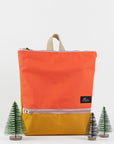 Vibrant Orange & Yellow Backpack – Waterproof & Durable by Muni at www.brixbailey.com