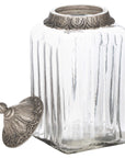 Handcrafted Moroccan lidded jar with hammered metal detailing and glass body for jewelry or spice storage by Sostter at brixbailey.com
