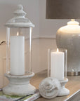 White glass hurricane lantern candle holder with cylindrical design, perfect for LED candles and home decor ambiance. by sostter at brixbailey.com