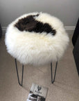Luxury British sheepskin seat cover, premium 100% natural round hide, white and dark brown, 35cm diameter, hypoallergenic, sustainable by Wildash London at brixbailey.com