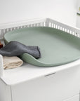 Premium Sebra changing mat in seagrass green, stylish Scandinavian design, soft water-repellent surface, safe high edges, easy to clean by Ella James at brixbailey.com