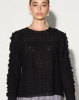 Luxury black ruffled blouse with lace inserts, puff sleeves, and romantic eyelet fabric by GILD at brixbailey.com
