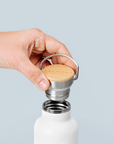 Premium Arctic Bottle, double-wall vacuum-insulated stainless steel, keeps drinks hot or cold, eco-friendly bamboo lid, leak-proof, BPA-free by Arcticus at brixbailey.com