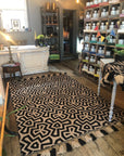 Premium monochrome flat weave rug, handmade in India with pure wool, stylish geometric design and tassel trim, neutral tones by Maria Starling Design at brixbailey.com