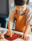 Premium Vegan Leather Apron for Crafts, Baking, and Sensory Play with Adjustable Strap and Front Pocket by Vincabel's Playground at brixbailey.com