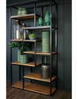 Industrial metal shelf unit with six distressed brown shelves, open framework, and heavy-duty storage capacity. by sostter at brixbailey.com