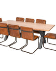 Handcrafted acacia wood dining table with live edges and metal cross-frame base, seats 8 in natural brown and grey tones. by Sostter at brixbailey.com