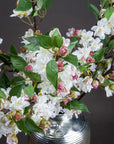 Lifelike English blossom branch with soft pink silk flowers and green leaves on natural brown stems, 90cm tall by sostter at brixbailey.com