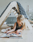 elegant montessori climbing triangle in natural wood, folded at 20.08 height for refined play space