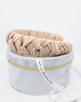 Light Beige Silk Knotted Headband - Crown Design with Metal Logo Tag - Elegant & Durable by Eva Oherjus at www.brixbailey.com