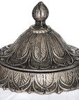 Handcrafted Moroccan lidded jar with hammered metal detailing and glass body for jewelry or spice storage. by Sostter at brixbailey.com