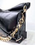 Black Leather Handbag with Metallic Accents, Crossbody