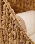 Luxury handwoven water hyacinth toilet paper holder, stylish modern bathroom storage with wooden handle, natural woven basket design by Ella James at brixbailey.com