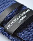 navy blue skinny knitted tie with light blue polka dots