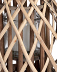 Handwoven rattan lantern with bulbous shape, natural brown wicker, casting warm light patterns for home decor. by sostter at brixbailey.com