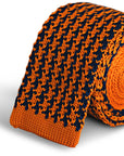 navy and orange dogtooth design knitted tie