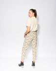 Premium tapered pleated pants with high waist, detachable belt, and pockets, crafted from 100% cotton IKAT fabric by GILD at brixbailey.com