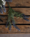 Lifelike faux lavender stems with purple blooms and green accents in a decorative vase, perfect for year-round home decor by sostter at brixbailey.com