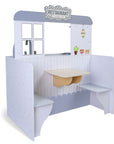 soft-lit wooden diner playset with a warm, comforting glow from the kitchen side