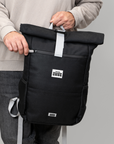 Luxury waterproof hemp backpack, durable Polar Explorer Backpack with laptop compartment, USB charging, ergonomic support, adjustable straps, hidden pockets, supports polar bear conservation by Arcticus at brixbailey.com