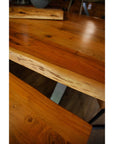 Handcrafted acacia wood live edge dining table with grey metal legs, showcasing natural wood grain and rustic-modern design. by sostter at brixbailey.com