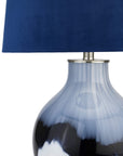 Handcrafted Ice Shadows table lamp with blue and white glaze, navy velvet shade, and elegant ball finial. by Sostter at brixbailey.com