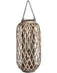 Handwoven rattan lantern with intricate natural weave, rich brown, creates warm light patterns for indoor or outdoor decor. by sostter at brixbailey.com