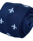 navy blue knitted tie with white embroidered fleur de lis lys design