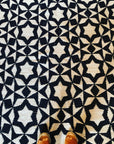 Premium monochrome flat weave wool rug, handmade in India, stylish geometric design with tassels, best-selling contemporary decor by Maria Starling Design at brixbailey.com