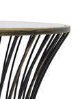 Handcrafted brass side table with black patina finish, mirrored glass top, and concave silhouette for modern interiors. by Sostter at brixbailey.com