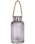 Frosted grey glass lantern with star-like LED glow, natural rope handle, modern rustic design for indoor or outdoor ambiance. by sostter at brixbailey.com