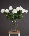 Lifelike white artificial rose stem with realistic petals, perfect for home decor or floral arrangements by sostter at brixbailey.com