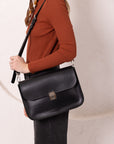 Black Leather Handbag with Buckle Closure