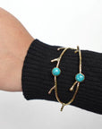 Turquoise/Moonstone Twig Open Brass Bangle - Nature-inspired twig bangle with turquoise stones—bold and earthy.
