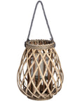Handwoven rattan lantern with bulbous shape, natural brown wicker, casting warm light patterns for home decor. by sostter at brixbailey.com