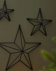 Matte black 3D metal star wall art with 8cm depth, modern geometric home decor accent by Sostter at brixbailey.com