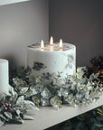 Marble-effect three-wick LED candle with amber flickering flames, neutral white decor accent. by Sostter at brixbailey.com