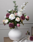 White artificial delphinium stem with realistic clustered florets, 84cm tall, perfect for elegant home floral arrangements. by sostter at brixbailey.com