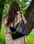 Black Leather Handbag with Metallic Accents, Crossbody