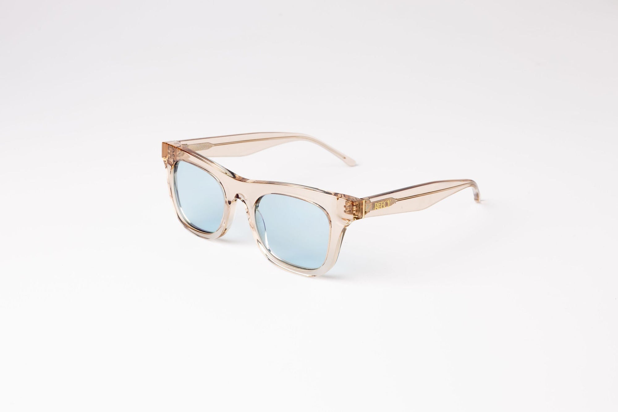 80s Inspired Risky Business Sunglasses - Clear Beige Frame & Blue Lens | UV Protection | Eco-Friendly Bioacetate Frames by Reecy at brixbailey.com