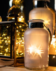 Frosted grey glass lantern with rope handle, glowing LED lights creating starlight effect, perfect for indoor or outdoor decor. by RoomLondon at brixbailey.com