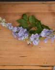 Lifelike lilac artificial wisteria with cascading clusters, soft gradients, and realistic plastic petals for home decor by sostter at brixbailey.com