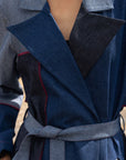 Luxury upcycled denim trench coat with patchwork, notch collar, and tie belt, ethically made in Delhi by Bethikal at brixbailey.com