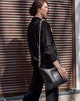 Classic Black Metallic Handbag – Elegant & Versatile Leather by Zelma Kraft at brixbailey.com