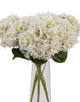 Lifelike white hydrangea floral arrangement in antique vase, handcrafted from high-quality plastic for year-round elegance. by sostter at brixbailey.com