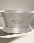 Antique silver champagne cooler with elegant detailing, handcrafted from premium metal, keeps drinks chilled in style. by sostter at brixbailey.com