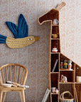 luxury tall giraffe bookcase, stylish safari-themed woven grass shelving unit, premium nursery storage for toys and books by Ella James at brixbailey.com
