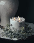 Marble-effect three-wick LED candle with realistic amber flickering flames, neutral white decor accent by Sostter at brixbailey.com