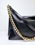 Black Leather Handbag with Metallic Accents, Crossbody