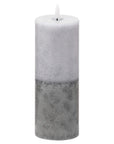 Handcrafted LED candle with realistic wax texture and two-tone stone finish, emitting warm amber glow for flameless ambiance. by Sostter at brixbailey.com